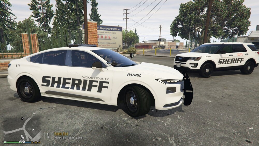 Could contain: vehicle, land vehicle, wheel, text, transport, outdoor, tire, police car, full-size car, auto part, mid-size car, car, law enforcement, police, street