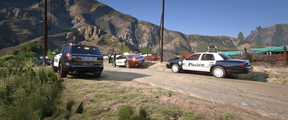 Could contain: outdoor, vehicle, land vehicle, wheel, sky, mountain, tire, road, transport, vehicle registration plate, motor vehicle, truck, auto part, automotive exterior, car, ground, police, driving