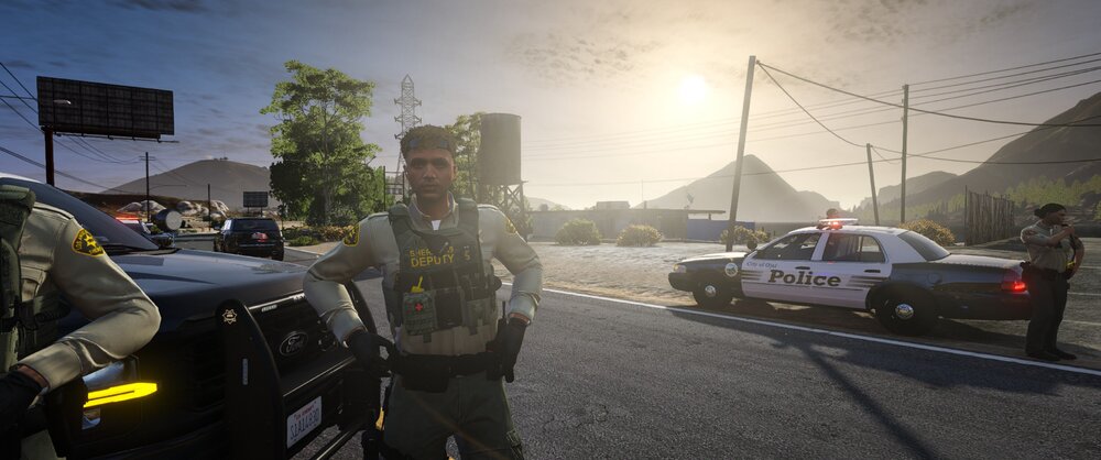 Could contain: outdoor, sky, vehicle, land vehicle, wheel, clothing, person, text, man, tire, road, law enforcement, vehicle registration plate, police, officer, street, car