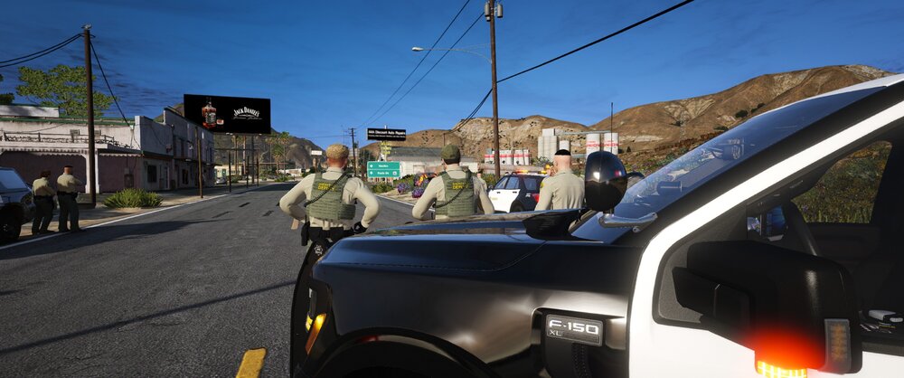 Could contain: outdoor, sky, land vehicle, wheel, road, tire, auto part, motor vehicle, automotive exterior, automotive carrying rack, automotive luggage rack, transport, person, street, police, car, vehicle, parked