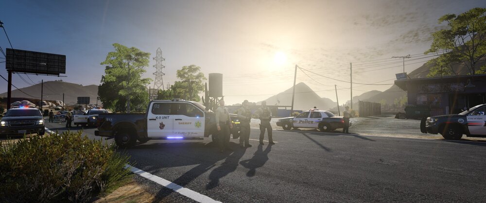 Could contain: outdoor, sky, land vehicle, vehicle, road, tree, text, wheel, vehicle registration plate, road surface, way, asphalt, thoroughfare, lane, car, traffic, street light, street, ground, sun