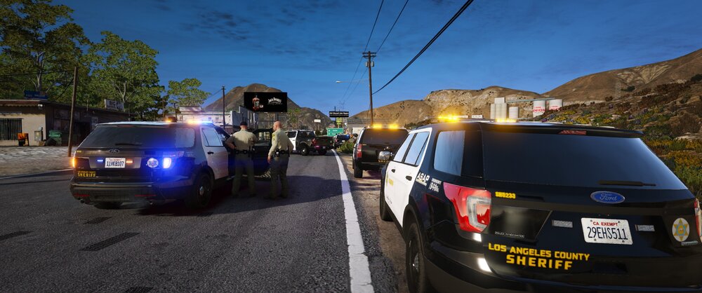 Could contain: outdoor, land vehicle, vehicle, sky, wheel, text, tire, vehicle registration plate, auto part, sport utility vehicle, transport, automotive exterior, motor vehicle, automotive lighting, automotive tail & brake light, road, family car, compact sport utility vehicle, bumper, automotive parking light, automotive carrying rack, automotive luggage rack, van, parked, car, street, mountain, light, police, ground