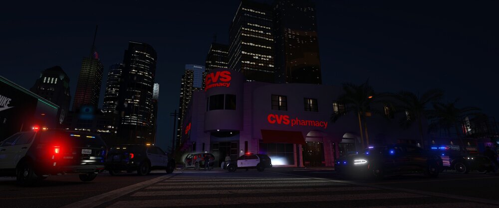 Could contain: outdoor, building, sky, vehicle, light, night, land vehicle, road, car, skyscraper, downtown, street light, electricity, metropolitan area, traffic light, street, city, red