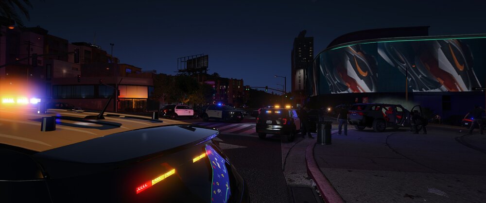 Could contain: outdoor, sky, vehicle, land vehicle, car, building, road, street, street light, light, night, city