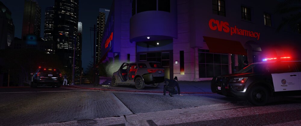 Could contain: building, land vehicle, vehicle, outdoor, text, wheel, road, car, light, night, street, city, parked, downtown