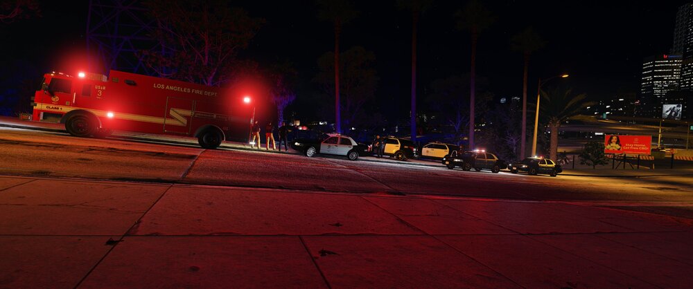 Could contain: outdoor, street light, night, street, light, building, electricity, sky, road, skyscraper, road surface, city, ground, red
