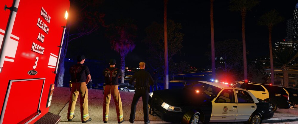Could contain: outdoor, vehicle, car, land vehicle, footwear, firefighter, street light, street, night, person, people, light, ground, city, standing