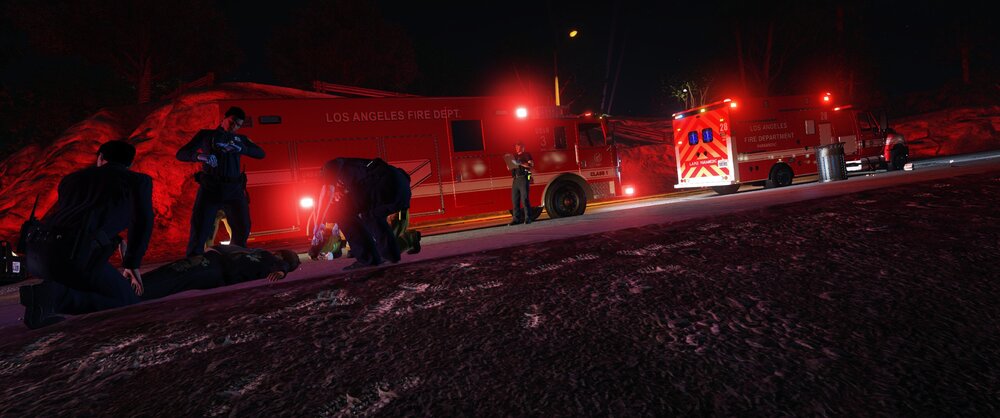 Could contain: firefighter, outdoor, night, fire, people, light, ground, red, person