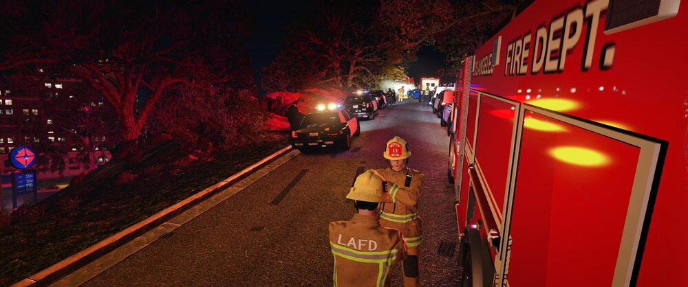 Could contain: firefighter, outdoor, vehicle, land vehicle, clothing, emergency service, fire, person, red, ground, standing, night