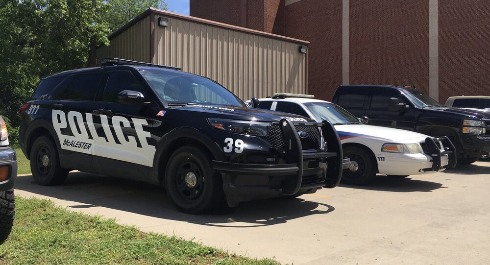 Could contain: vehicle, land vehicle, wheel, outdoor, tire, transport, law enforcement, auto part, police car, automotive exterior, full-size car, motor vehicle, car, text, bumper, road, police, parked, street