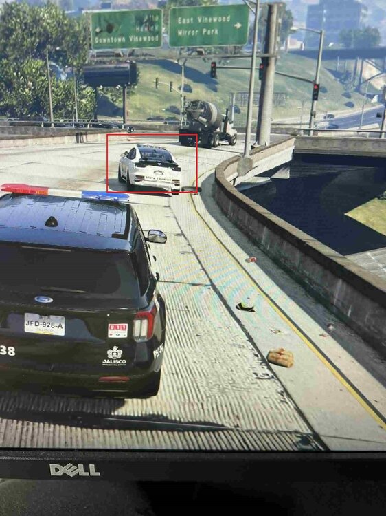 Could contain: text, vehicle, land vehicle, outdoor, wheel, car, road, vehicle registration plate, ground, track