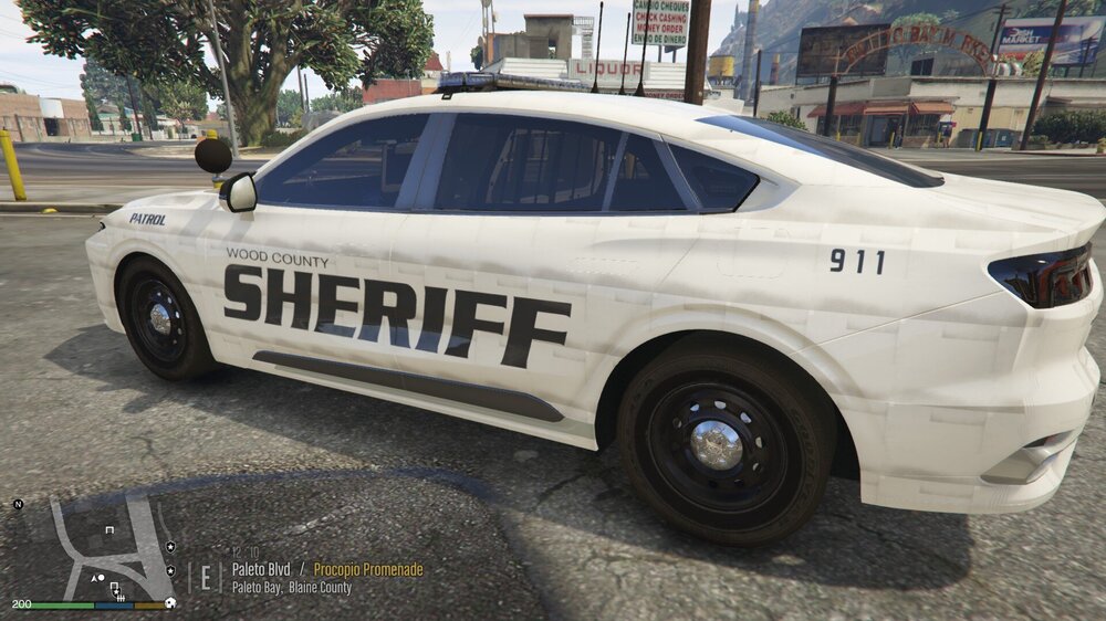 Could contain: vehicle, land vehicle, wheel, text, transport, tire, full-size car, outdoor, police car, sedan, law enforcement, car, mid-size car, auto part, police, sports sedan