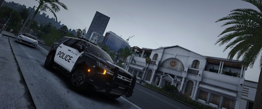 Could contain: outdoor, vehicle, land vehicle, sky, tree, car, building, road, palm tree, auto part, street, ground, driving, travel, track