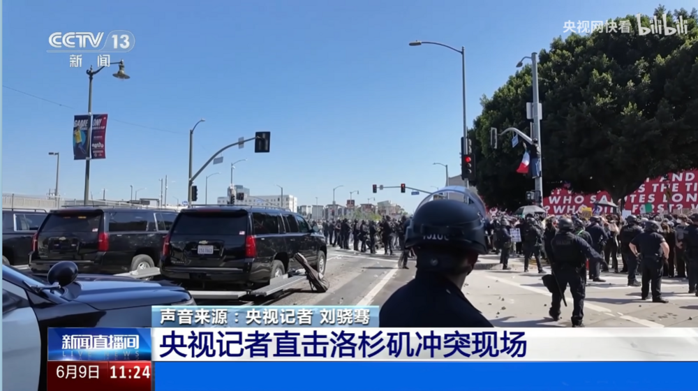 Could contain: text, outdoor, sky, land vehicle, vehicle, car, billboard, road, street, people, police, person, parade, officer