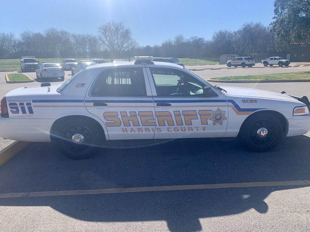 Could contain: vehicle, land vehicle, outdoor, wheel, text, transport, tire, sky, police car, law enforcement, full-size car, ford crown victoria police interceptor, auto part, automotive exterior, ford, police, car, parked, ground