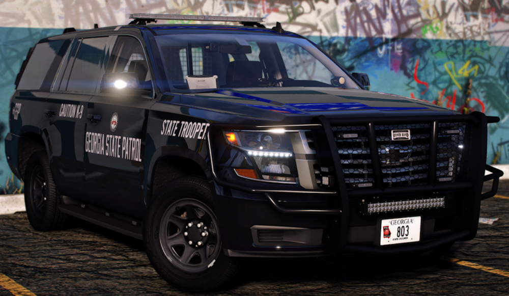 Could contain: vehicle, land vehicle, wheel, tire, bumper, auto part, grille, outdoor, general motors, sport utility vehicle, chevrolet, text, transport, parked, police, truck, van, car