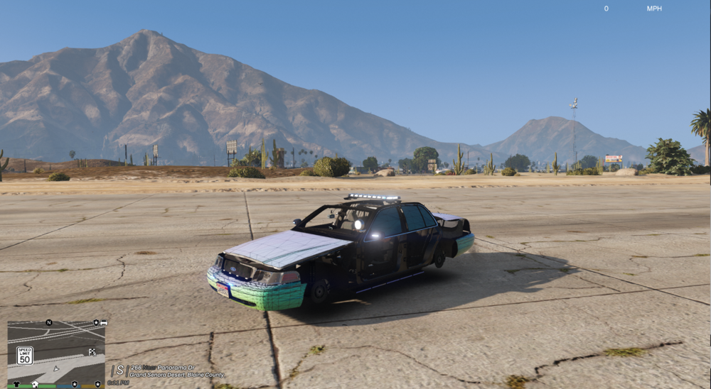 Could contain: outdoor, vehicle, land vehicle, ground, wheel, sky, mountain, tire, parked, desert, car