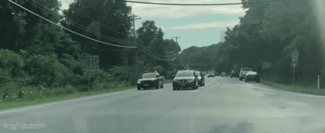Could contain: outdoor, road, tree, vehicle, land vehicle, sky, car, highway, thoroughfare, lane, road surface, asphalt, freeway, street, way, infrastructure, windshield, wheel, mode of transport