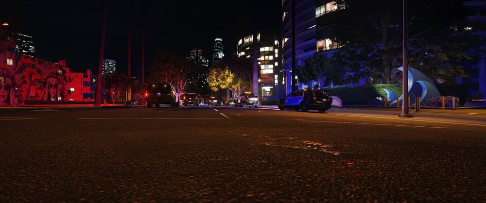 Could contain: outdoor, night, street light, tree, building, street, sky, lighting, electricity, light, road, city, ground