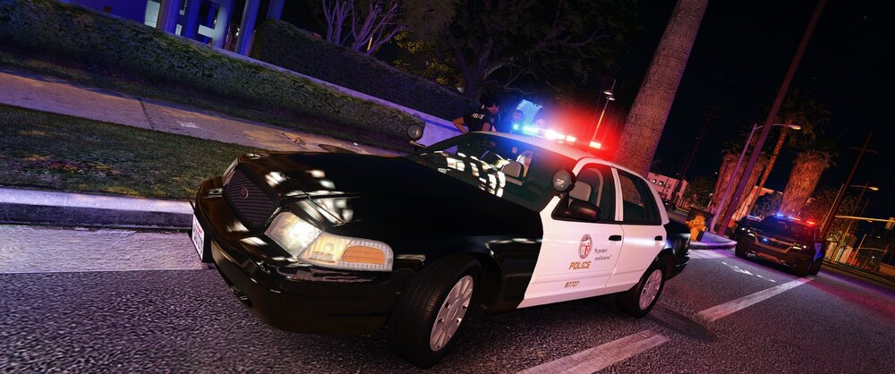 Could contain: vehicle, land vehicle, outdoor, wheel, road, street, car, transport, automotive lighting, tire, auto part, ground, night, light, city, curb