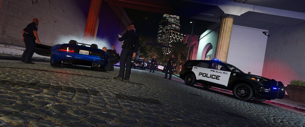 Could contain: vehicle, land vehicle, wheel, building, tire, outdoor, automotive design, car, ground, night, street, light