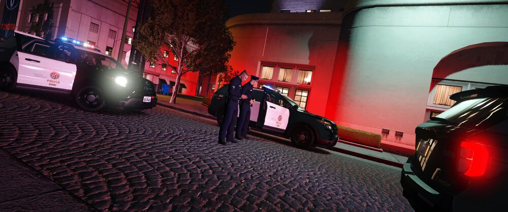 Could contain: vehicle, land vehicle, car, outdoor, building, automotive tail & brake light, automotive lighting, light, night, ground, street, red, parked