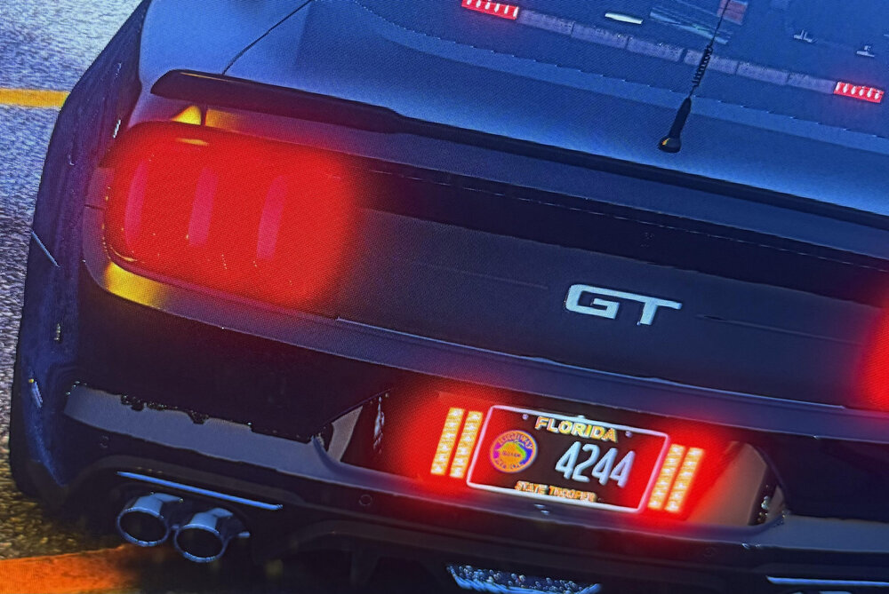 Could contain: text, vehicle, car, automotive tail & brake light, automotive lighting, land vehicle, vehicle registration plate, trunk, automotive exterior, automotive design, bumper, automotive side marker light, automotive light bulb, lamp, auto part, outdoor, red, automotive