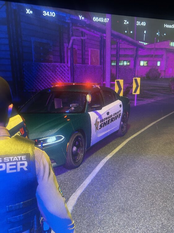 Could contain: vehicle, land vehicle, wheel, outdoor, tire, text, building, person, clothing, transport, road, car, street, blue, purple