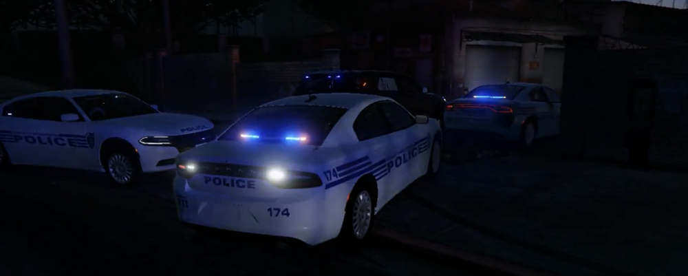 Could contain: vehicle, transport, land vehicle, car, wheel, outdoor, full-size car, auto part, police car, police, road, night, street, light