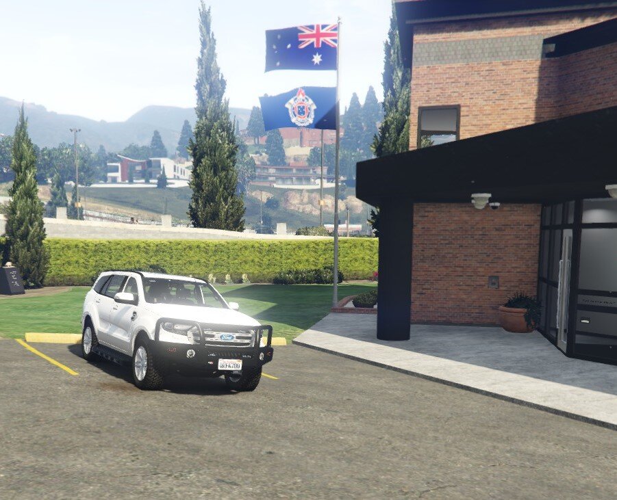 Could contain: outdoor, vehicle, land vehicle, sky, wheel, road, tire, building, tree, family car, text, vehicle registration plate, automotive parking light, car, street, parked, parking, sign