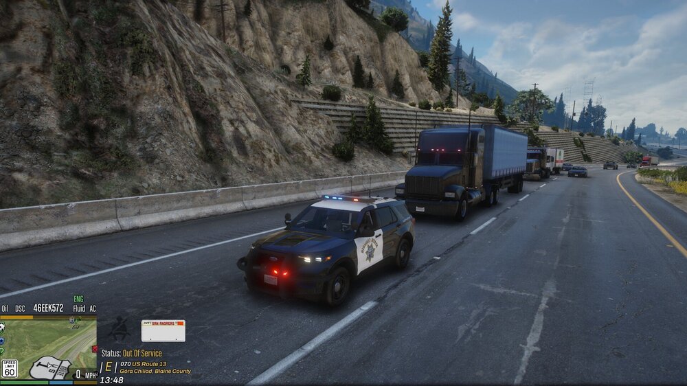 Could contain: outdoor, vehicle, land vehicle, wheel, road, text, tire, sky, motor vehicle, vehicle registration plate, mode of transport, asphalt, car, automotive exterior, cloud, mountain, freeway, transport, highway, street, way, truck, driving