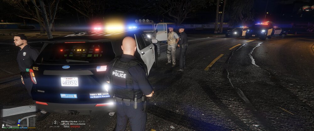 Could contain: vehicle, outdoor, land vehicle, text, clothing, person, man, tire, vehicle registration plate, road, car, ground, street, light