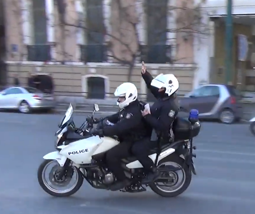 Could contain: vehicle, land vehicle, outdoor, wheel, road, tire, motorbike, auto part, helmet, motorcycle helmet, street, motorcycle fairing, sport, police, riding, person, motorcycling, motorcycle