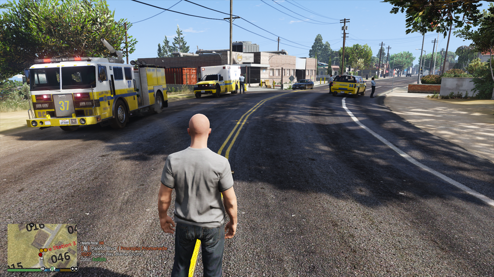 Could contain: outdoor, land vehicle, vehicle, tree, sky, road, wheel, firefighter, clothing, man, truck, asphalt, emergency service, road surface, emergency vehicle, tarmac, transport, emergency, person, street, ground, yellow