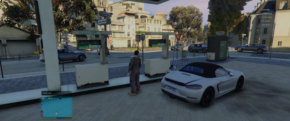 Could contain: vehicle, land vehicle, outdoor, wheel, road, building, ground, car, street