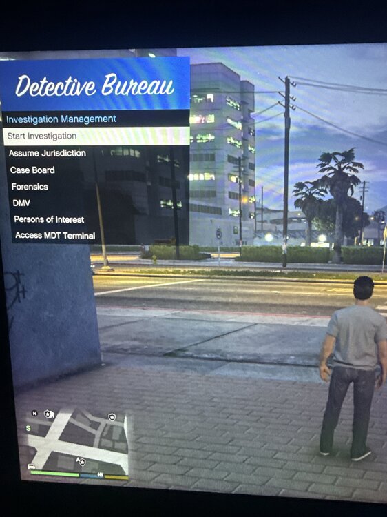 Could contain: text, clothing, footwear, outdoor, billboard, sky, man, person, screenshot, ground