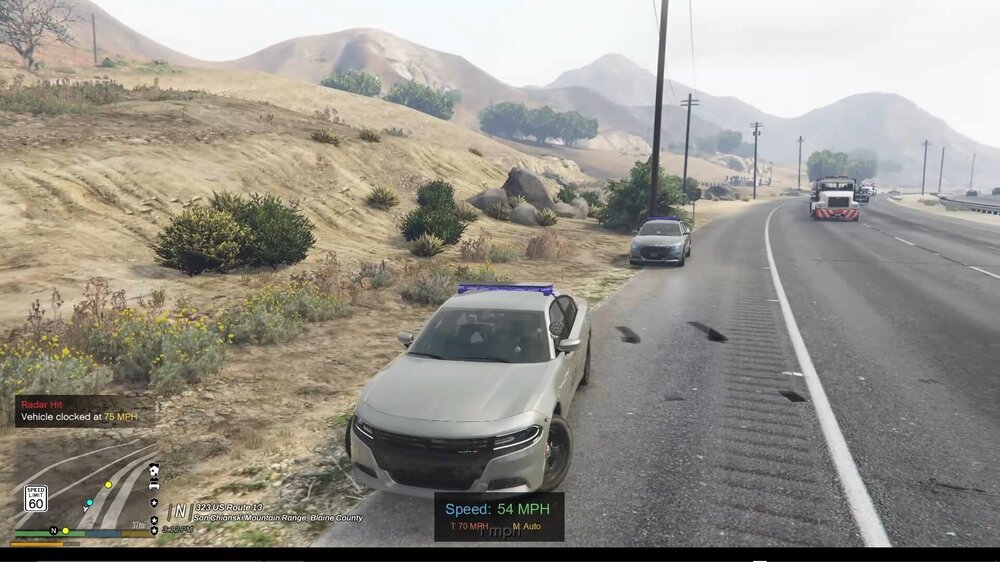 Could contain: outdoor, land vehicle, sky, road, mountain, car, text, freeway, thoroughfare, way, lane, asphalt, road surface, vehicle registration plate, truck, wheel, traffic, motor vehicle, mountain pass, windshield, street, highway, travel, vehicle