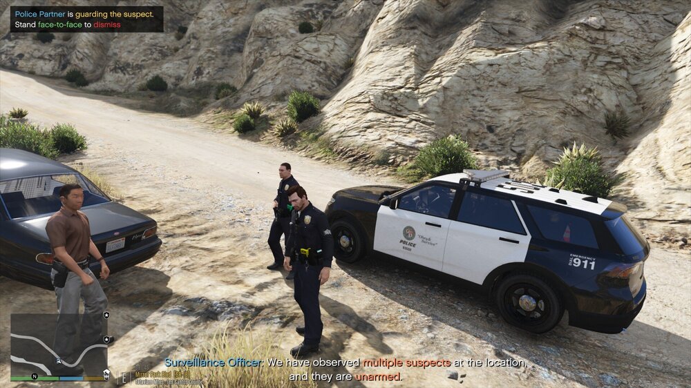 Could contain: vehicle, land vehicle, outdoor, text, wheel, car, transport, tire, clothing, ground, person, mountain, police