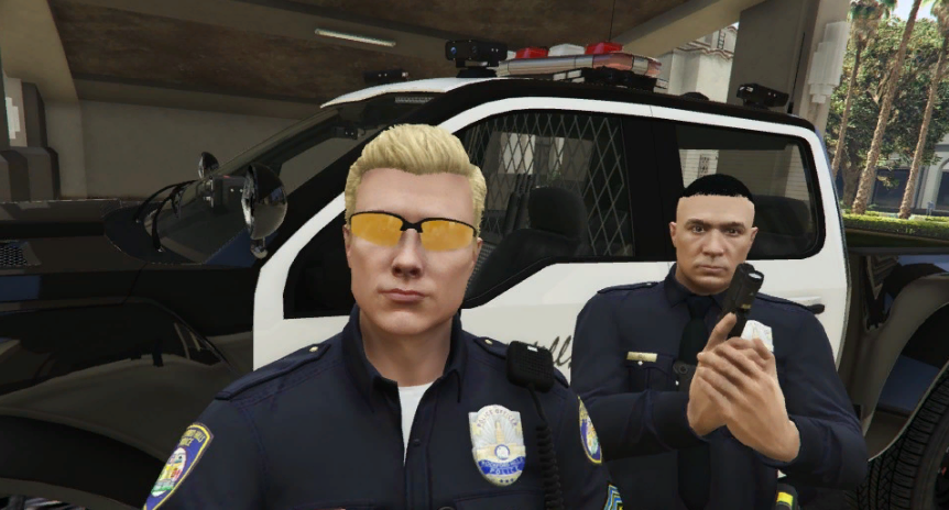 Could contain: person, clothing, land vehicle, human face, law enforcement, man, police, officer, car, security, official, police officer, outdoor, vehicle