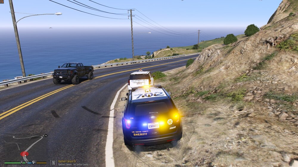 Could contain: outdoor, vehicle, land vehicle, sky, road, wheel, ground, mountain, street, traveling, driving, car