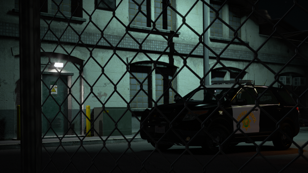 Could contain: vehicle, building, wire fencing, iron, land vehicle, chain-link fencing, mesh, street, outdoor