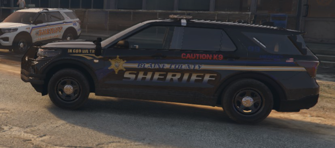 Could contain: vehicle, land vehicle, wheel, tire, car, transport, outdoor, auto part, law enforcement, police car, automotive exterior, text, sport utility vehicle, ford, road, automotive tire, motor vehicle, police, street