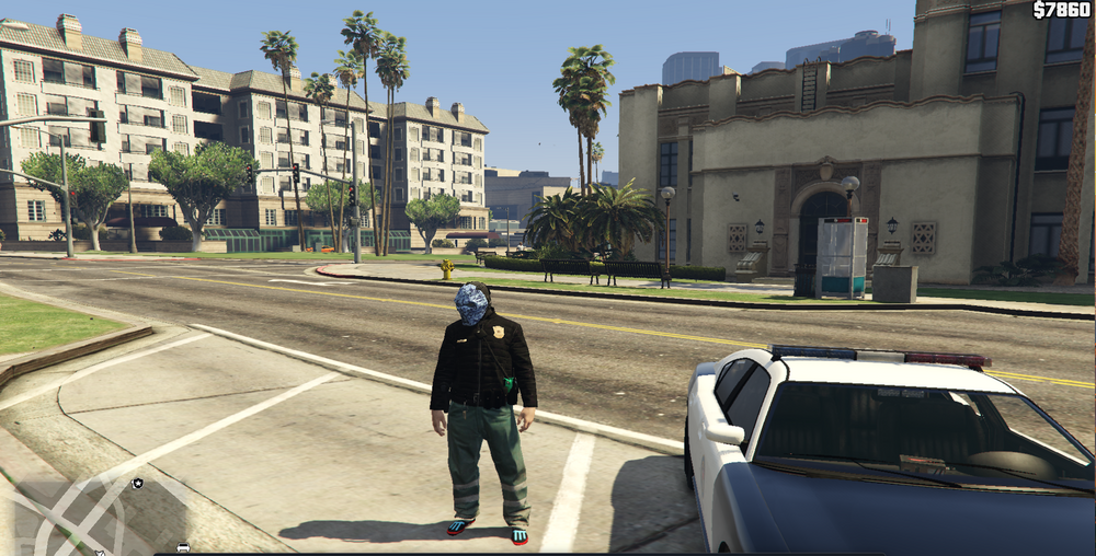 Could contain: outdoor, vehicle, road, land vehicle, building, sky, car, person, tree, man, wheel, clothing, street, officer, city