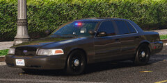 Could contain: vehicle, land vehicle, outdoor, wheel, car, transport, tire, full-size car, sedan, road, bumper, mid-size car, ford crown victoria police interceptor, auto part, hardtop, vehicle registration plate, vehicle door, automotive side marker light, police, street, parked