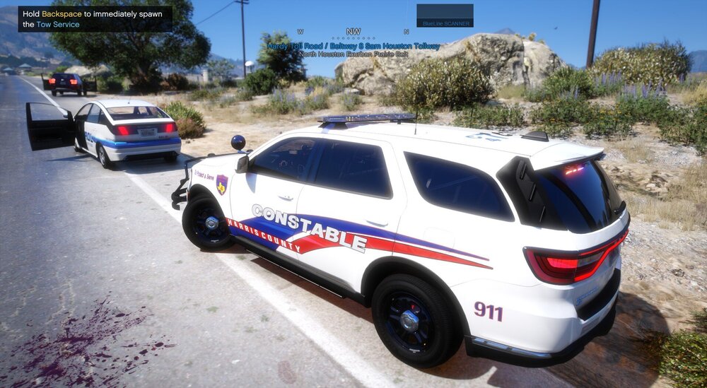 Could contain: vehicle, land vehicle, text, wheel, outdoor, transport, tire, police car, law enforcement, police, vehicle registration plate, van, car