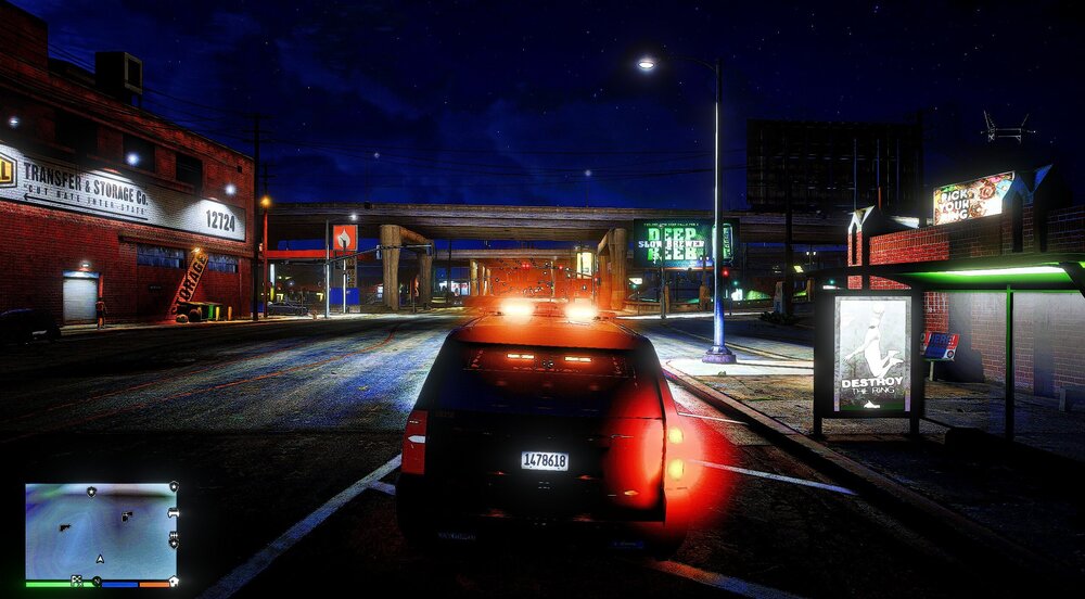 Could contain: outdoor, sky, vehicle, text, land vehicle, night, building, street light, electricity, billboard, light, ground, city, street