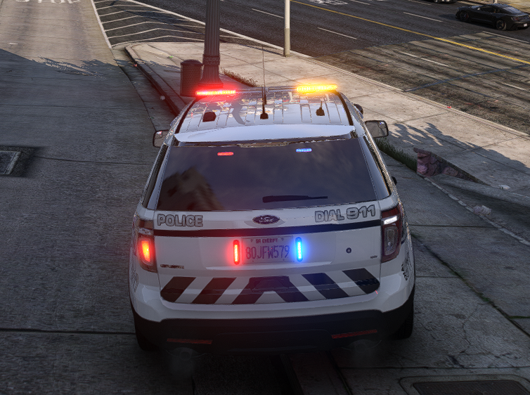 Could contain: vehicle, land vehicle, outdoor, wheel, emergency service, transport, emergency vehicle, police car, law enforcement, emergency, car, vehicle registration plate, road, text, full-size car, light, street, ground, police