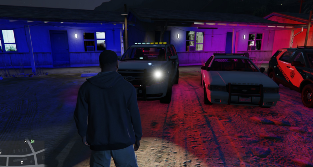 Could contain: land vehicle, vehicle, clothing, wheel, tire, person, ground, purple, night, floor, car, parked