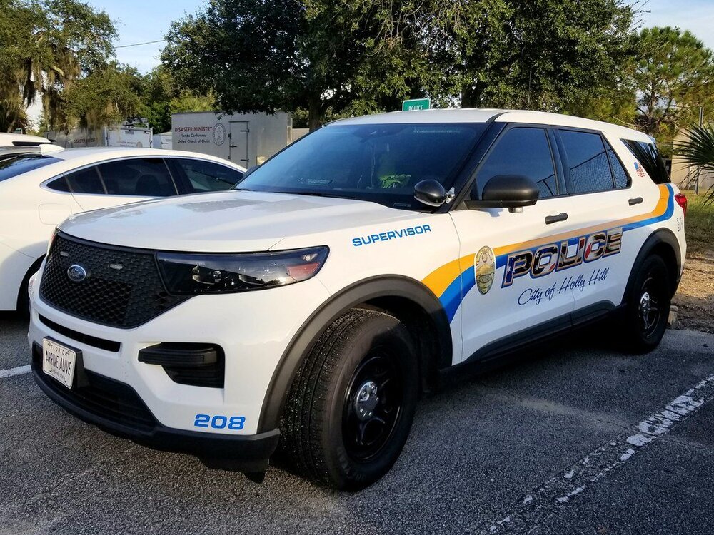 Could contain: land vehicle, vehicle, wheel, outdoor, tire, text, car, bumper, auto part, transport, police, sport utility vehicle, ford, police car, automotive exterior, compact sport utility vehicle, crossover suv, automotive design, mitsubishi