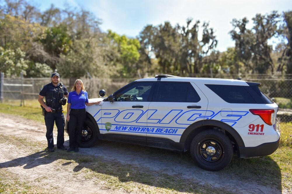 Could contain: outdoor, vehicle, land vehicle, wheel, sky, transport, tire, clothing, car, sport utility vehicle, police, ford, law enforcement, automotive exterior, person, compact sport utility vehicle, roof rack, police car, grass